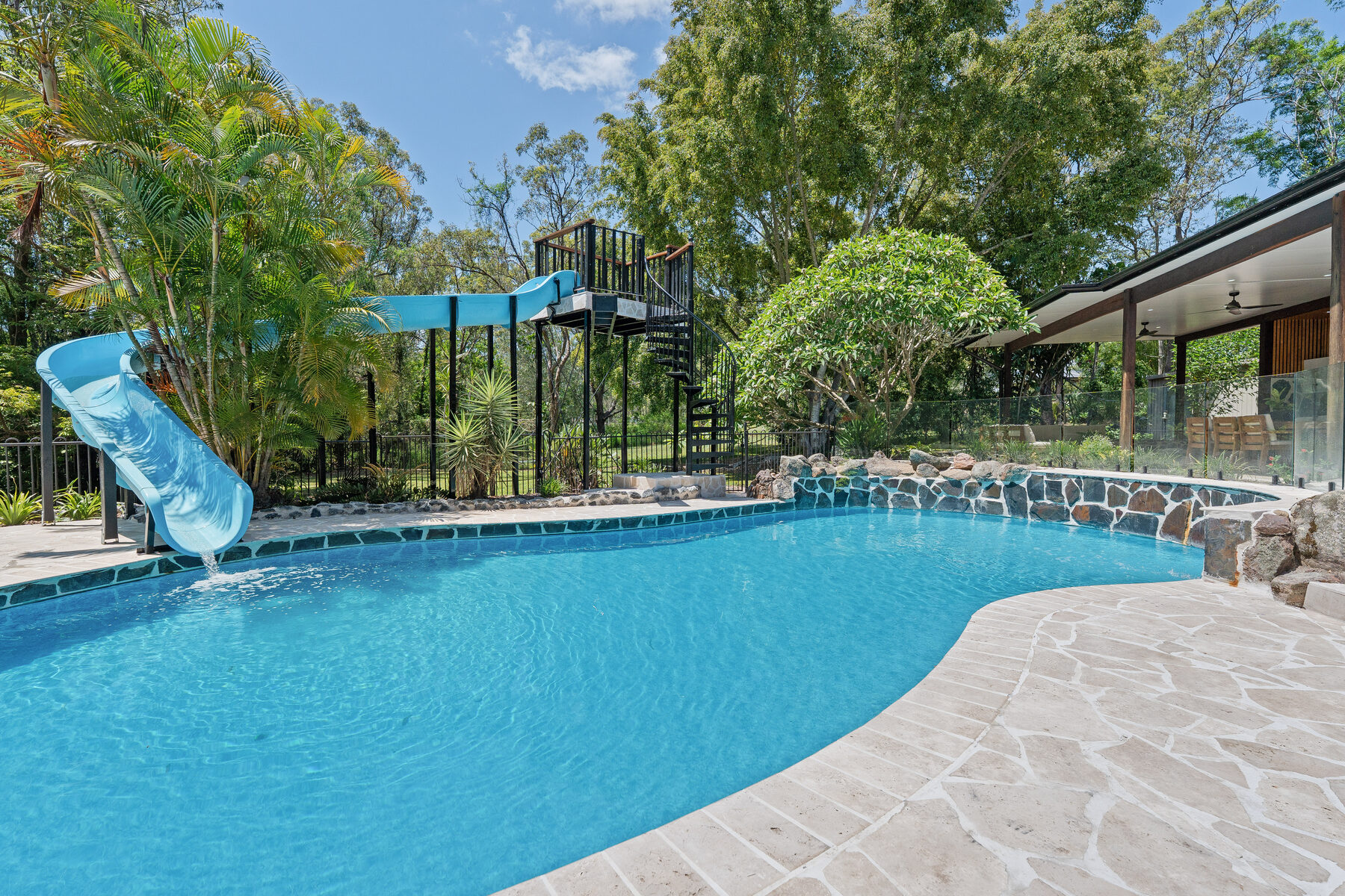 Custom water slide into pool
